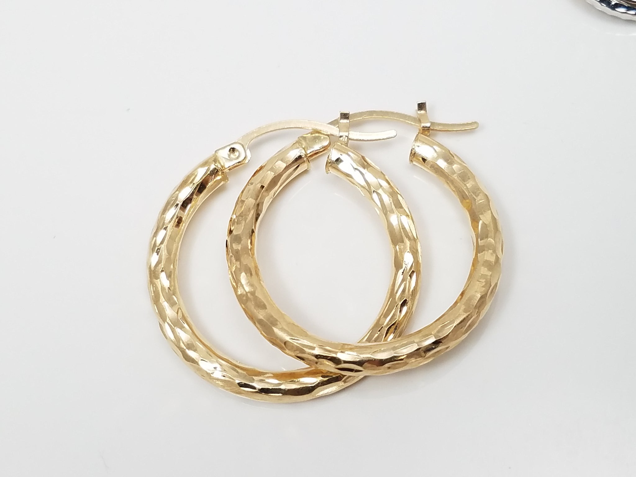 Three Pairs of 10k Gold Hollow Diamond Cut Hoop Earrings