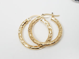 Three Pairs of 10k Gold Hollow Diamond Cut Hoop Earrings