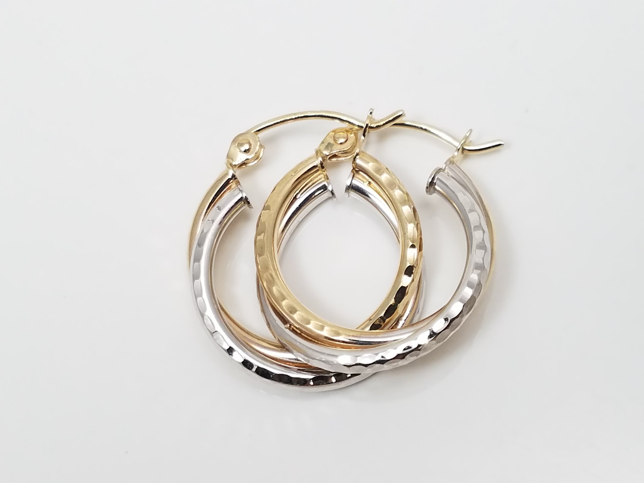 Three Pairs of 10k Gold Hollow Diamond Cut Hoop Earrings