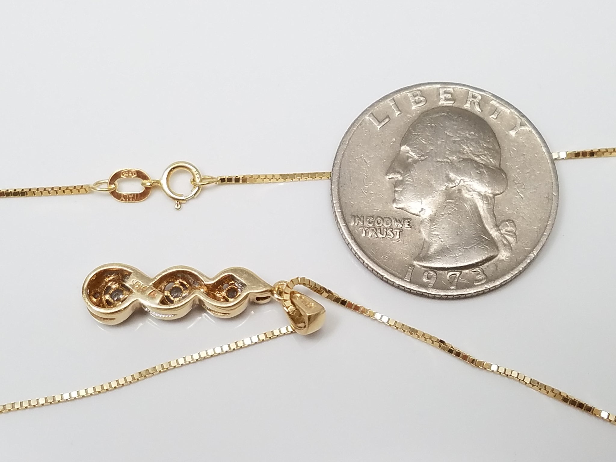 10k Yellow Gold Natural Diamond Swirl Pendant Necklace