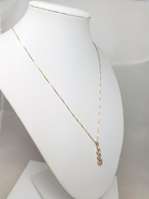 10k Yellow Gold Natural Diamond Swirl Pendant Necklace