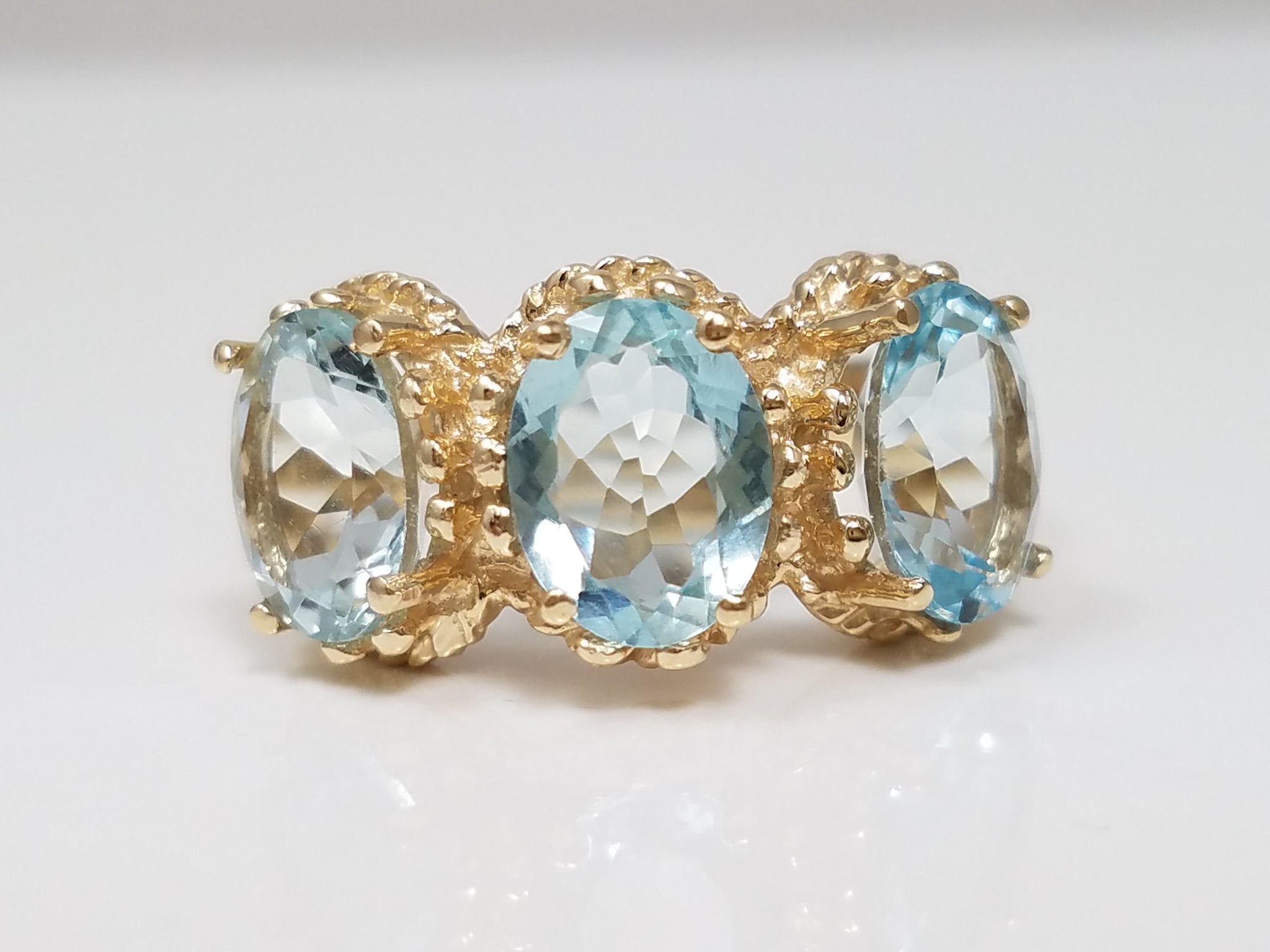 Brilliant 10k Yellow Gold Natural Aquamarine Three Stone Ring