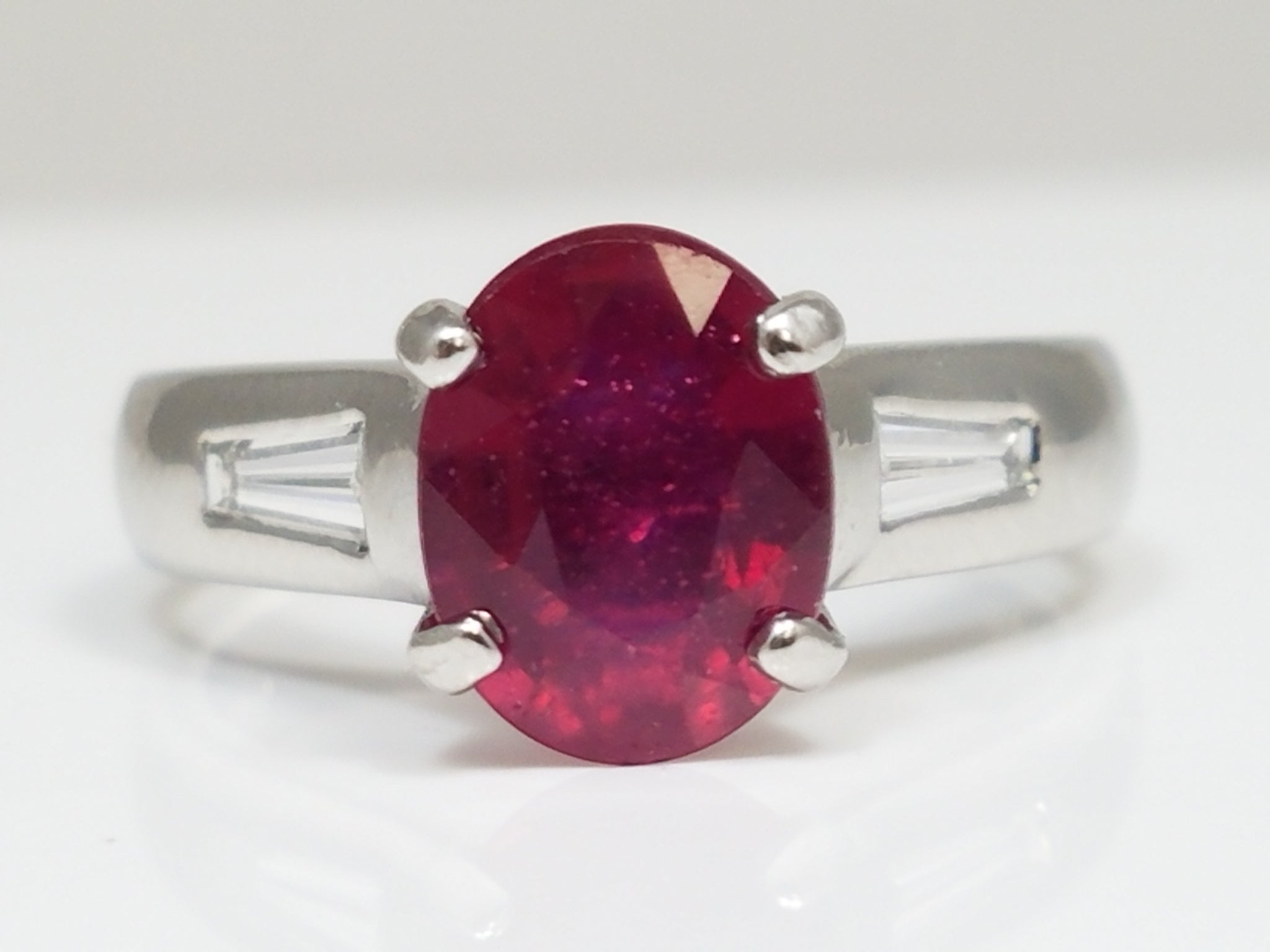Gleaming Platinum Natural Glass Filled Ruby Diamond Ring