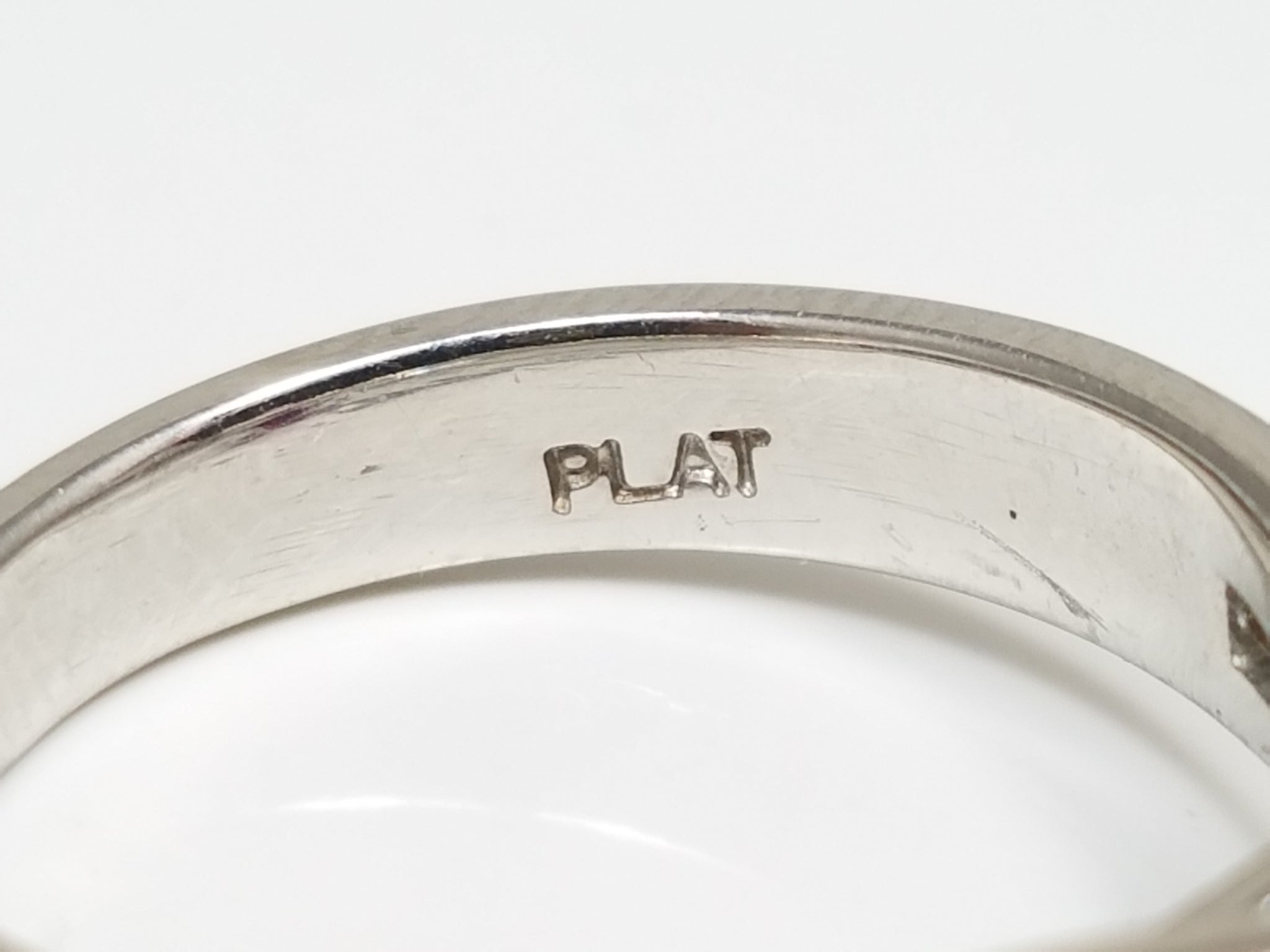 Gleaming Platinum Natural Glass Filled Ruby Diamond Ring